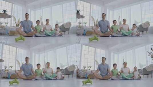友好的家庭与孩子在家里练习瑜伽高清在线视频素材下载