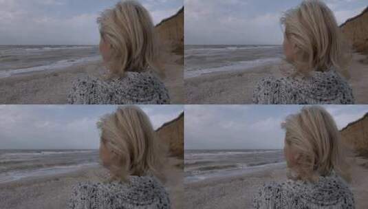 海岸吹风的女孩高清在线视频素材下载