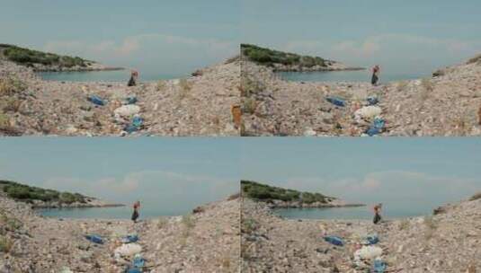 女人在清洁海滩垃圾 高清在线视频素材下载