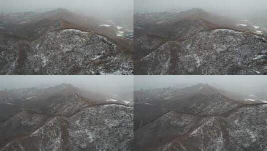 航拍俯瞰飞雪中的威海里口山群山高清在线视频素材下载