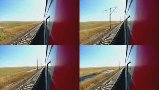 草原上行驶的红色火车高清在线视频素材下载