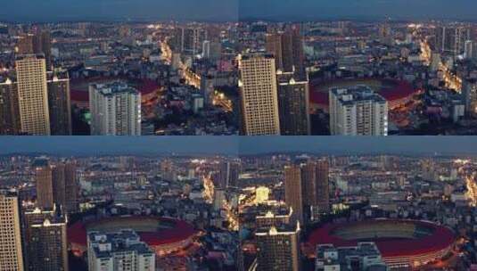 汇都国际楼顶航拍华灯初上时的昆明城市风光高清在线视频素材下载