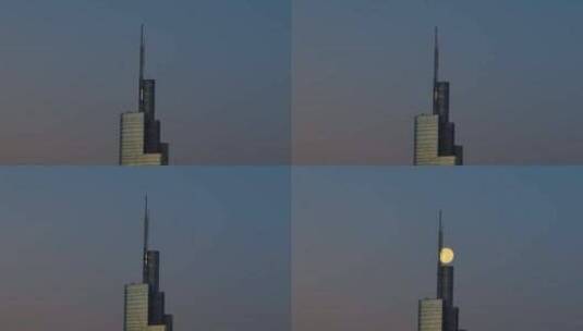 航拍南京紫峰大厦和满月合影高清在线视频素材下载