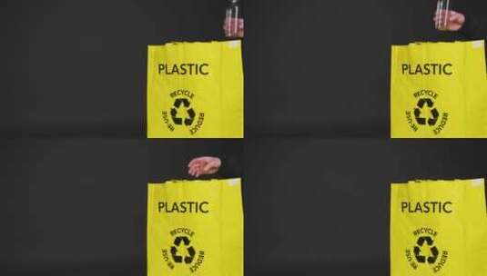 塑料瓶被放入回收袋的中景照片高清在线视频素材下载