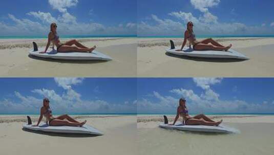 年轻的美女模特在天堂白沙和蓝色背景的海滩上海边旅行高清在线视频素材下载