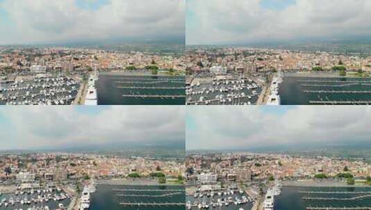 空中，空码头旁边满是船只的码头，沿海城镇，镜头广阔。里波斯托，西西里岛。高清在线视频素材下载