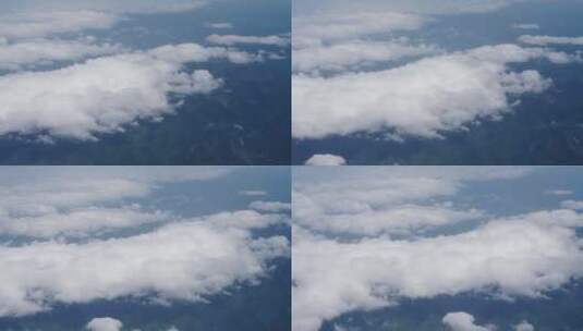 飞机上看窗外山川白云云绕峰顶高清在线视频素材下载
