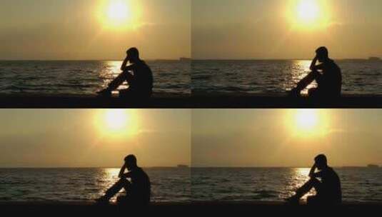 悲伤男人坐在海边-孤独背影高清在线视频素材下载