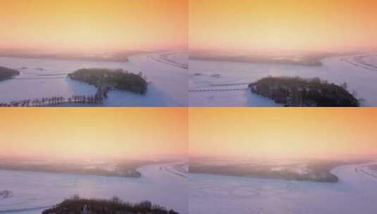 航拍哈尔滨冰封的松花江日出高清在线视频素材下载