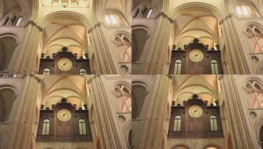 法国卡昂圣艾蒂安修道院内一个大钟的低角度高清在线视频素材下载
