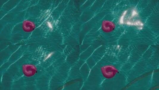 航拍一个漂浮在游泳池中的充气浮子高清在线视频素材下载