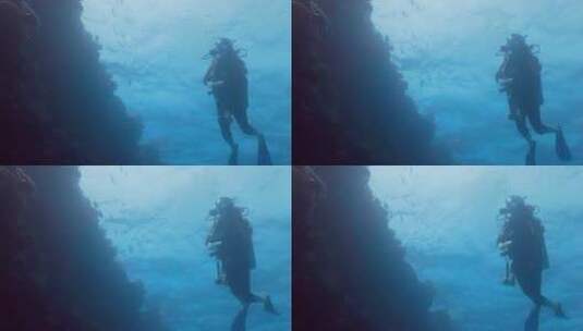 潜水员在海底暗礁处潜水高清在线视频素材下载