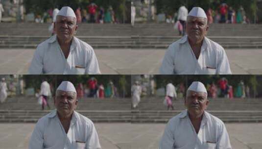 戴白帽的印度老人高清在线视频素材下载