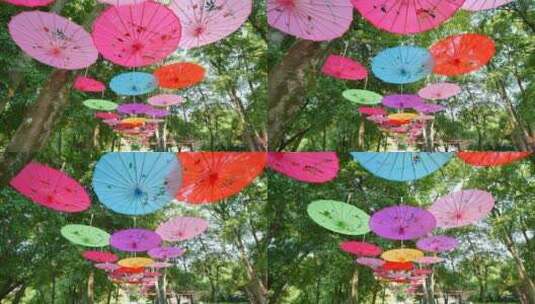 公园小路油纸伞高清在线视频素材下载