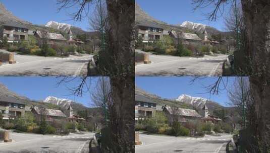 蓝天下的雪山和房屋高清在线视频素材下载