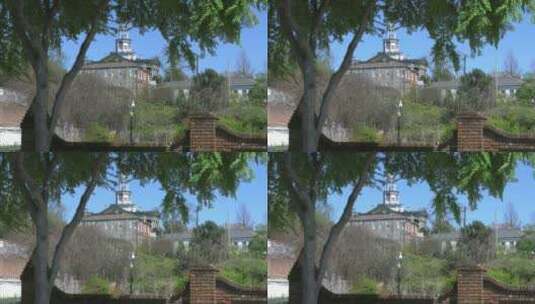 远景拍摄大树下的建筑景观高清在线视频素材下载