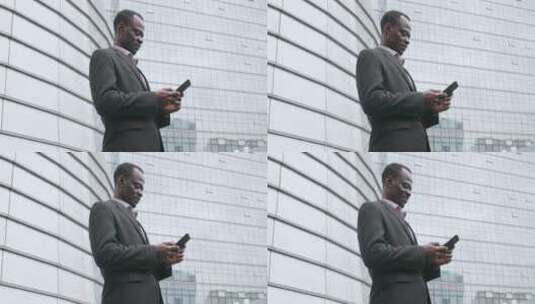 非洲黑人商人用手机高清在线视频素材下载