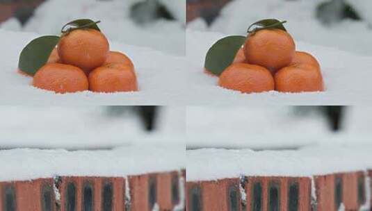 冬天冬季下飘雪沙糖桔红砖墙积雪高清在线视频素材下载