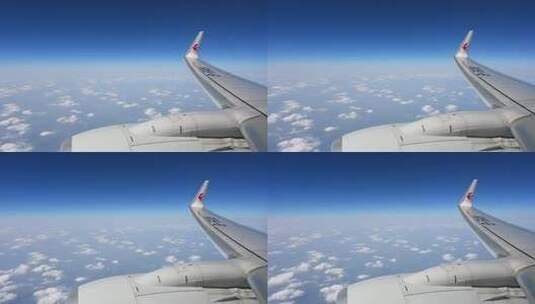 飞机飞行在云层之上透过舷窗俯瞰祖国大地高清在线视频素材下载