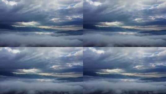 清晨的太阳光透过云层打在山川云雾之上高清在线视频素材下载