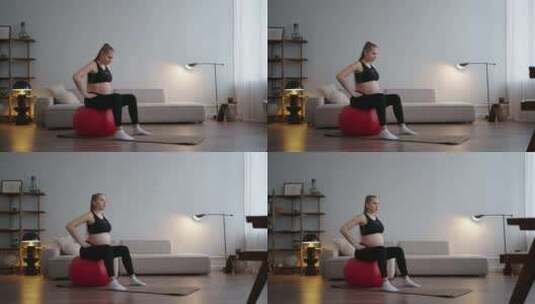 平衡运动与健身房球孕妇独自训练在家庭运动高清在线视频素材下载