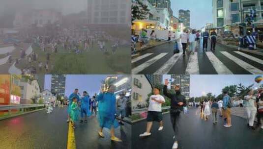 威海国际海水浴场火炬八街夏季雨雾天气人流高清在线视频素材下载