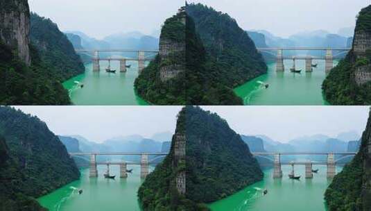 绿水青山间的大桥及江上小船景象高清在线视频素材下载