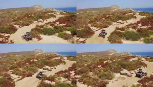 航拍汽车在沙漠中行驶高清在线视频素材下载