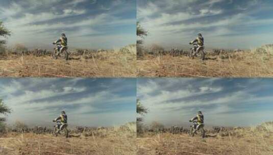 摩托车骑手在沙漠骑行高清在线视频素材下载
