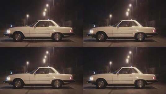 夜晚街道路灯下一辆静止的白色轿车高清在线视频素材下载