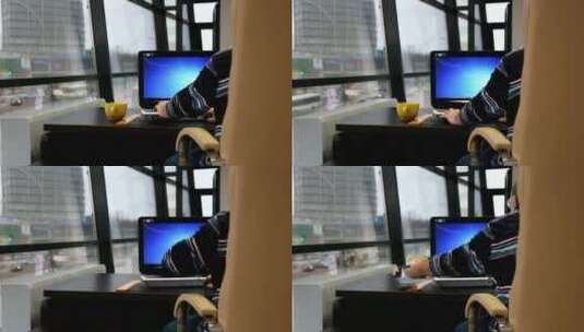 靠窗在电脑上工作的人高清在线视频素材下载