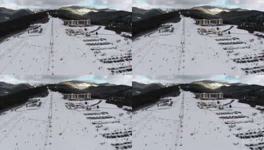 滑雪场和滑雪者下山高清在线视频素材下载