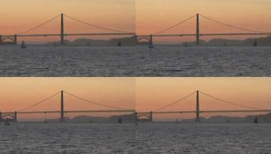 日落时金门大桥前的帆船高清在线视频素材下载