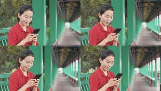 中国女性路边玩手机拍照通讯聊天高清在线视频素材下载