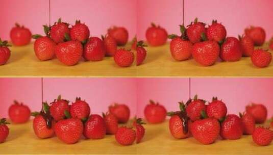 草莓覆盖着粉色背景的巧克力高清在线视频素材下载