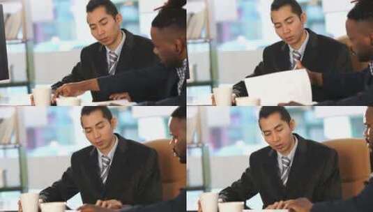 亚裔和非裔美国白领一起在办公室办公桌前工作。潘高清在线视频素材下载