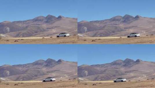 高原枯黄草原行驶的白色车辆4高清在线视频素材下载