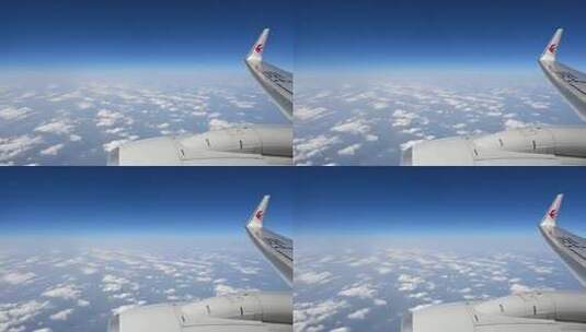 飞机飞行在云层之上透过舷窗俯瞰祖国大地高清在线视频素材下载