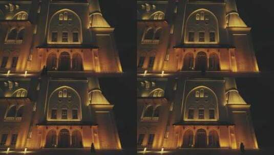 信徒夜间在大清真寺庭院行走的三脚架照片高清在线视频素材下载