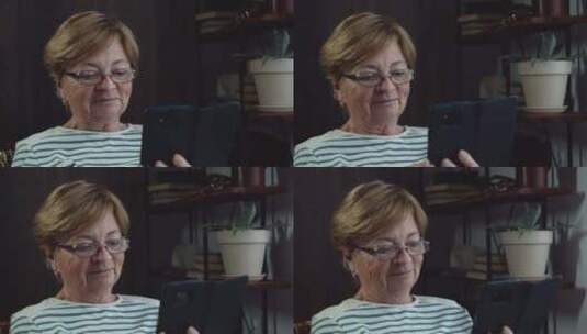 老年妇女在手机上使用视频聊天高清在线视频素材下载