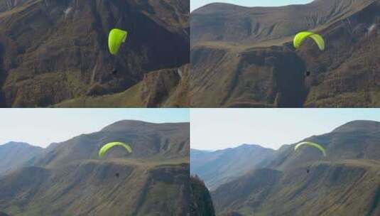 航拍降落伞飘过绵延不断的山脉高清在线视频素材下载