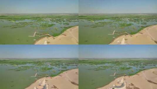 航拍宁夏石嘴山沙湖旅游景区湿地沙漠风光高清在线视频素材下载