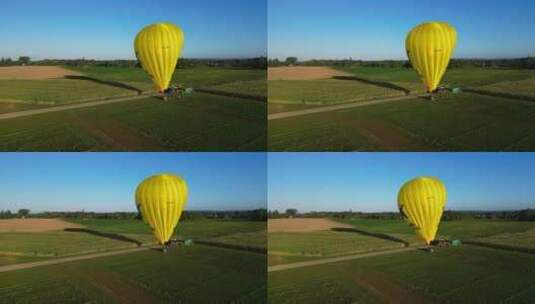 亮黄色热气球在野外飞行高清在线视频素材下载