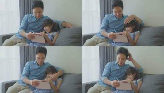 小女孩在家与父亲一起学习高清在线视频素材下载