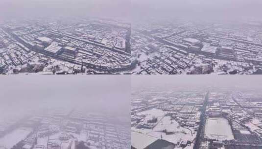 航拍乡镇雪景学校建筑田地大桥别墅河流房屋高清在线视频素材下载