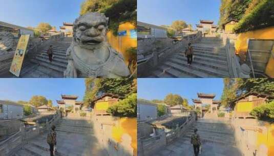 跟拍一位老人正爬上南京鸡鸣寺的楼梯高清在线视频素材下载