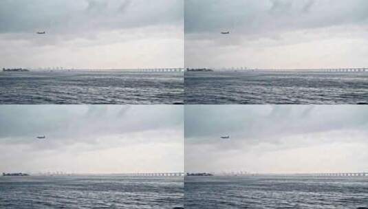 飞机飞越海洋和桥梁高清在线视频素材下载