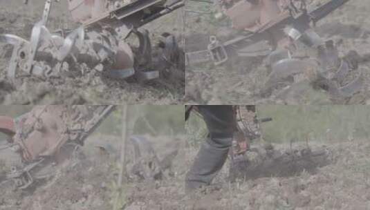 农业生产翻土机在土地上耕作的慢镜头高清在线视频素材下载