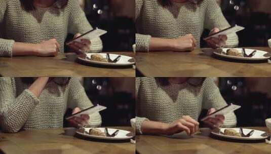 女人在餐厅使用手机高清在线视频素材下载