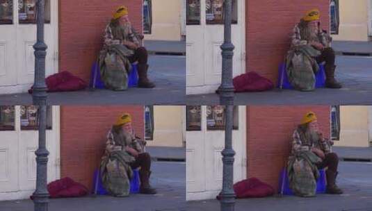 无家可归的人坐在街上高清在线视频素材下载